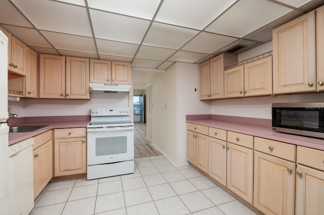 kitchen featuring a paneled ceiling, visible vents, light brown cabinetry, white appliances, and under cabinet range hood