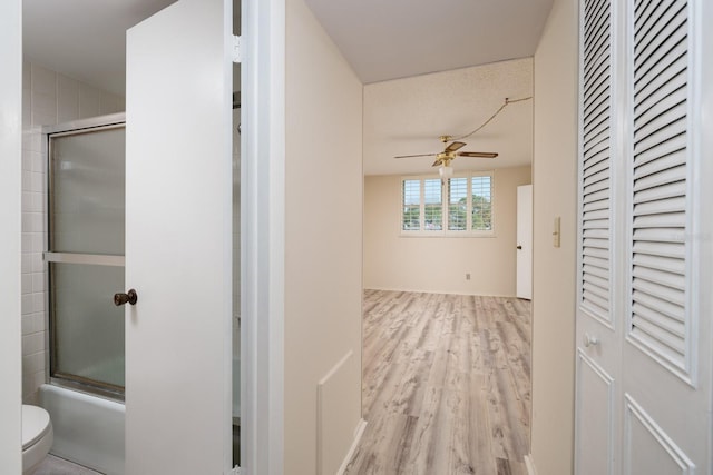 corridor with wood finished floors