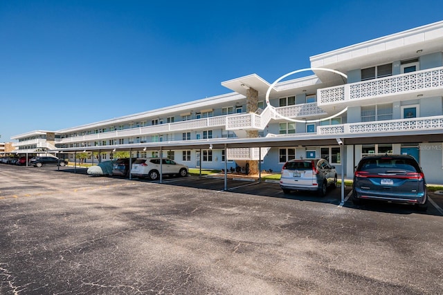 view of property featuring covered parking