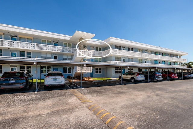 view of property with covered parking