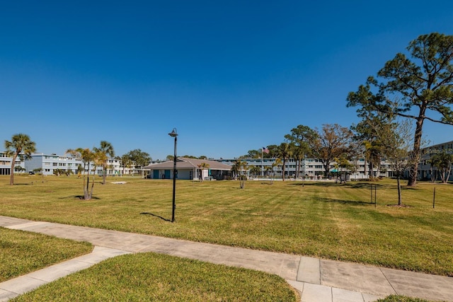 view of home's community with a lawn and a residential view