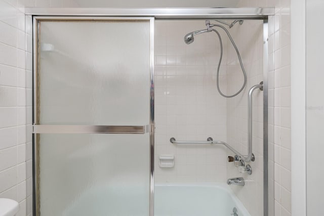 4715 Bay St NE Unit 323, Saint Petersburg, FL 33703 - bathroom with bath / shower combo with glass door and toilet