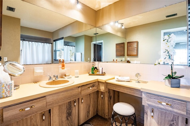 bathroom featuring vanity and visible vents