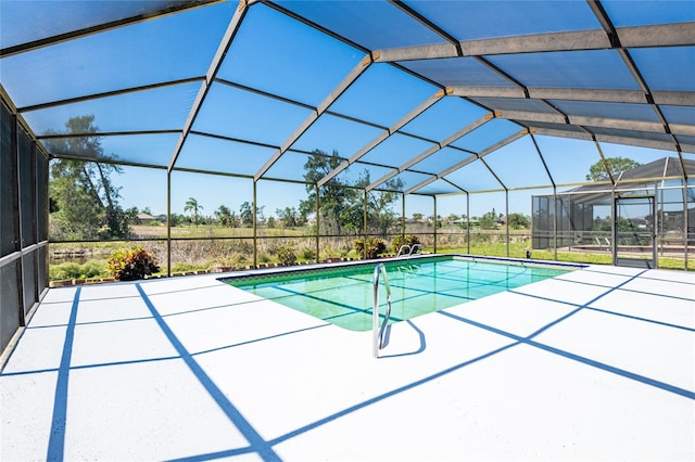 pool featuring a lanai and a patio