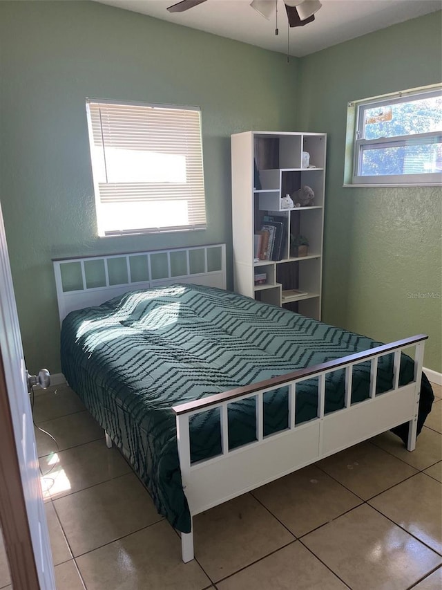 tiled bedroom with baseboards