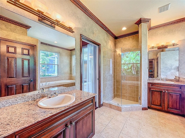 bathroom featuring visible vents, ornamental molding, a stall shower, vanity, and tile patterned floors