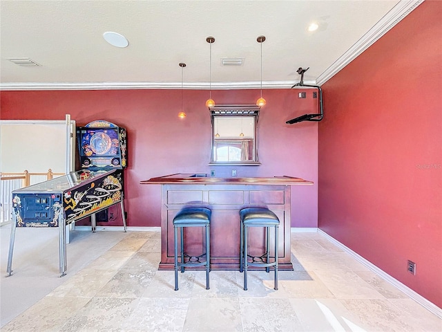 bar featuring baseboards, a dry bar, visible vents, and crown molding