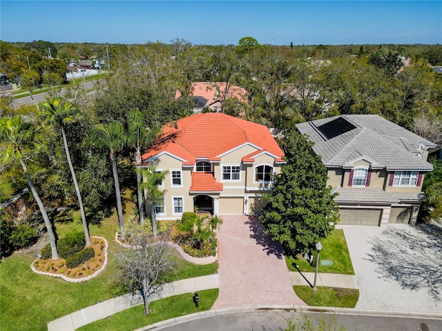 birds eye view of property with a view of trees