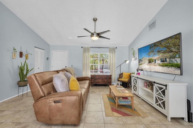 living room with lofted ceiling, light tile patterned floors, visible vents, and ceiling fan