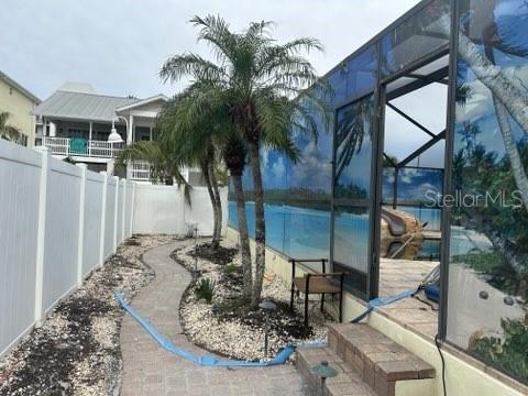 exterior space with a lanai and a fenced backyard