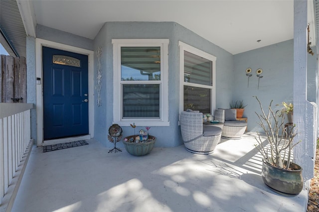 doorway to property with stucco siding