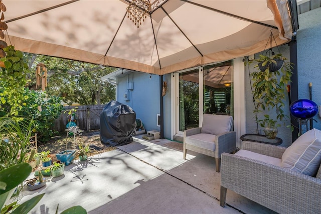 view of patio with fence and grilling area