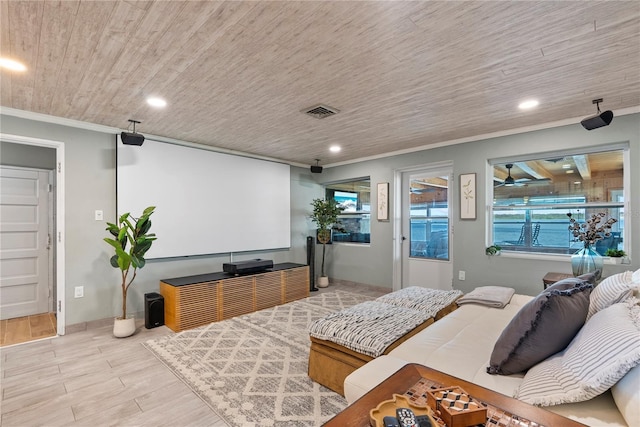 cinema room featuring wooden ceiling, recessed lighting, wood finished floors, baseboards, and crown molding