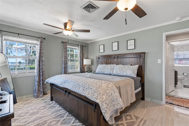 bedroom with baseboards, visible vents, ceiling fan, and crown molding