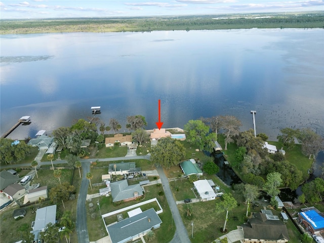 birds eye view of property with a water view