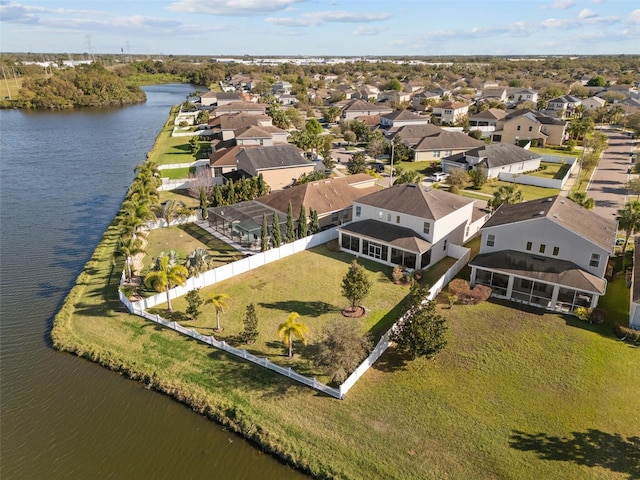 birds eye view of property featuring a residential view and a water view