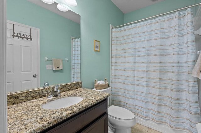 full bathroom featuring vanity, toilet, and tile patterned floors