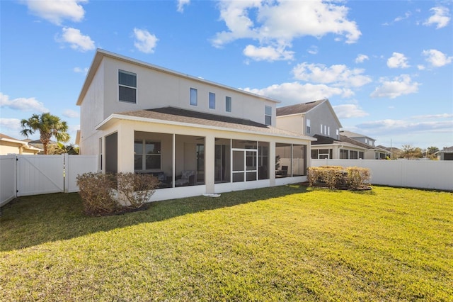 back of property with a yard, stucco siding, a sunroom, a gate, and a fenced backyard