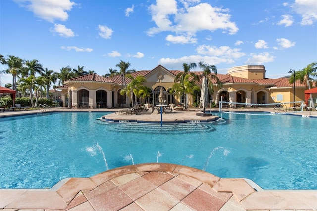 community pool featuring a patio area