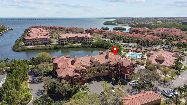 birds eye view of property with a water view