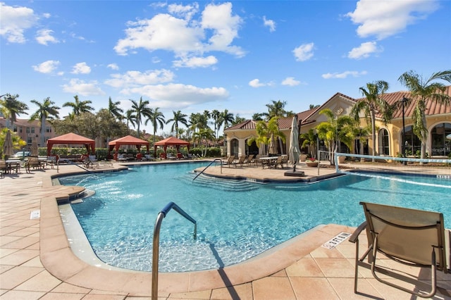 pool featuring a patio and a gazebo