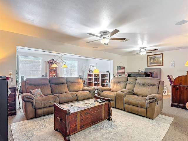 living room with carpet floors and a ceiling fan