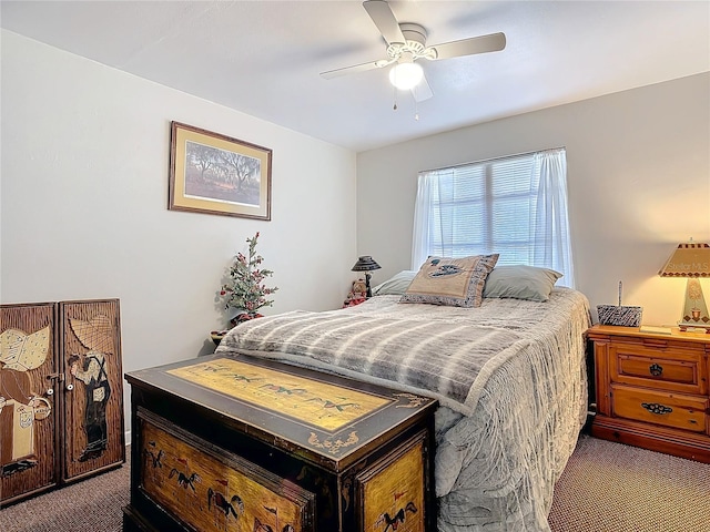 bedroom with a ceiling fan and carpet flooring