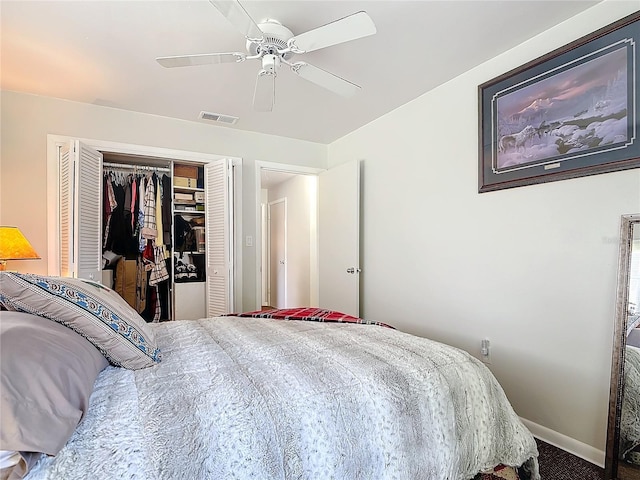 carpeted bedroom featuring a ceiling fan, a closet, visible vents, and baseboards