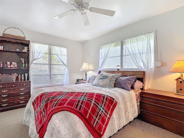 bedroom with ceiling fan and carpet floors