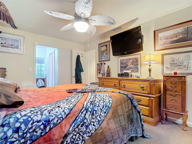 carpeted bedroom with visible vents and ceiling fan