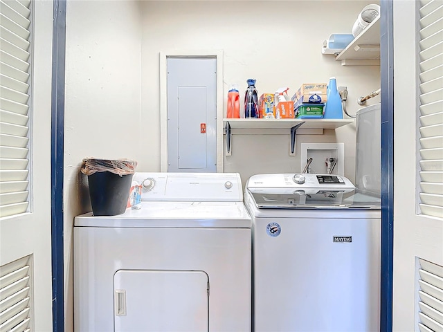 laundry room with laundry area, electric panel, and separate washer and dryer