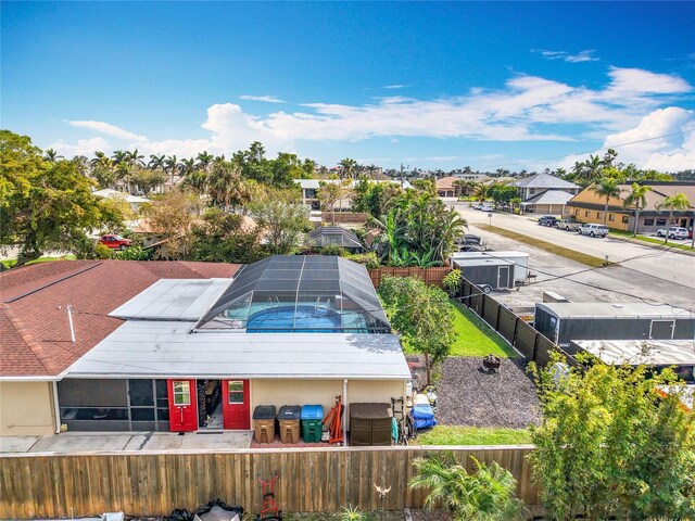 birds eye view of property with a residential view