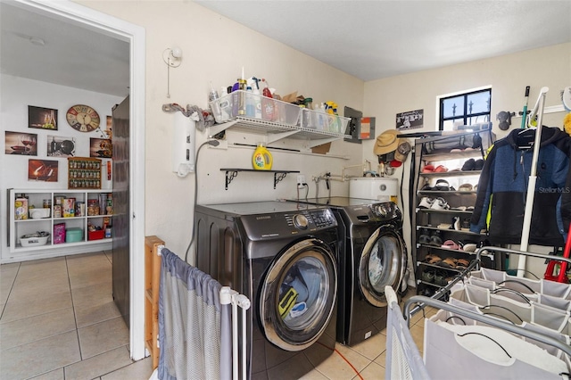 washroom with laundry area, tile patterned flooring, and washing machine and dryer