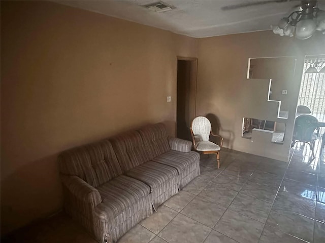 living area with visible vents and tile patterned floors