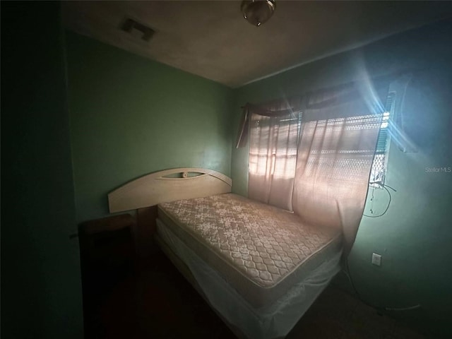 bedroom featuring visible vents