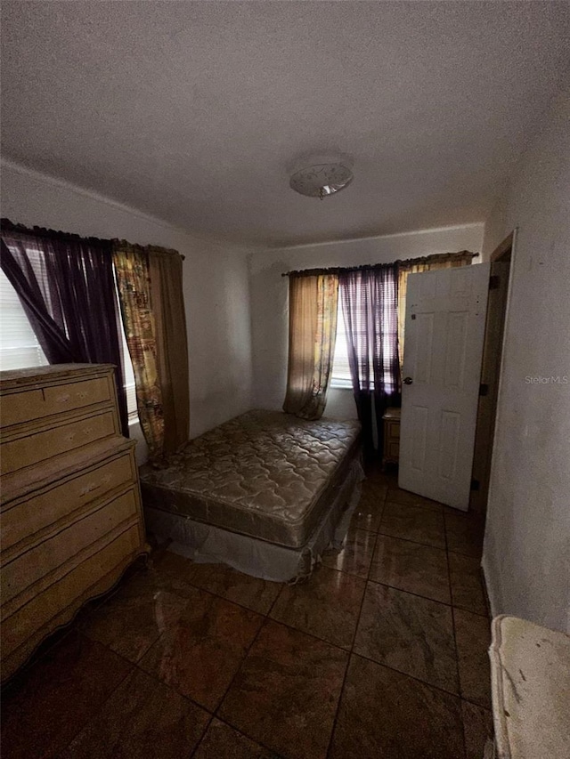 unfurnished bedroom featuring a textured ceiling