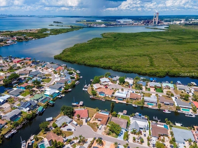 drone / aerial view with a residential view and a water view