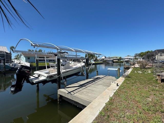 dock area featuring a water view and boat lift