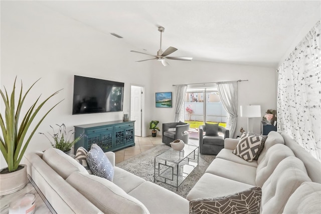 living room featuring lofted ceiling, visible vents, ceiling fan, and light tile patterned floors