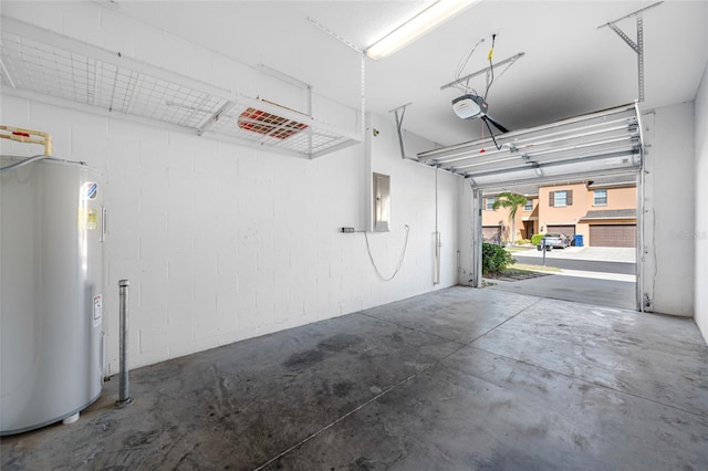 garage with a garage door opener, electric panel, and electric water heater