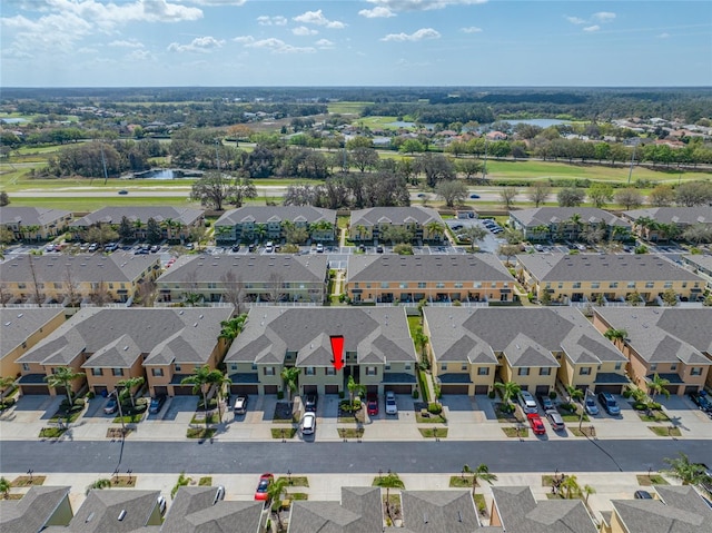 birds eye view of property featuring a residential view and a water view