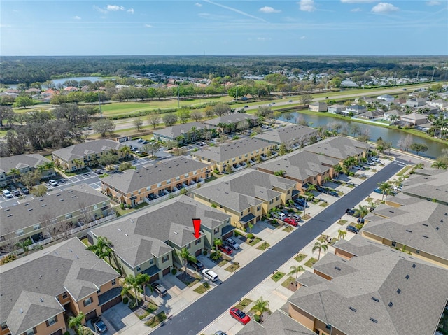 aerial view with a water view and a residential view