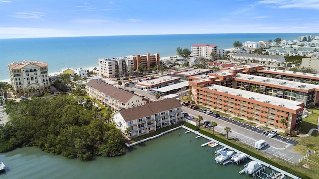 birds eye view of property featuring a view of city and a water view