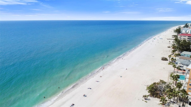 drone / aerial view featuring a view of the beach and a water view