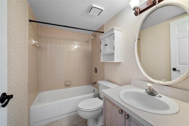 full bathroom featuring bathtub / shower combination, toilet, a textured ceiling, vanity, and wood finished floors