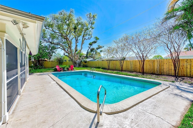 view of pool with a patio area, a fenced backyard, and a fenced in pool