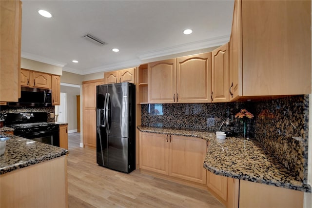 kitchen featuring crown molding, visible vents, light brown cabinetry, stone countertops, and black appliances