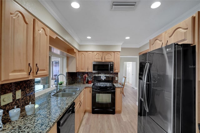 kitchen with light brown cabinets, a sink, light stone countertops, black appliances, and crown molding