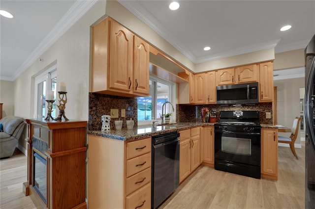 kitchen featuring light brown cabinets, a sink, ornamental molding, black appliances, and light wood finished floors