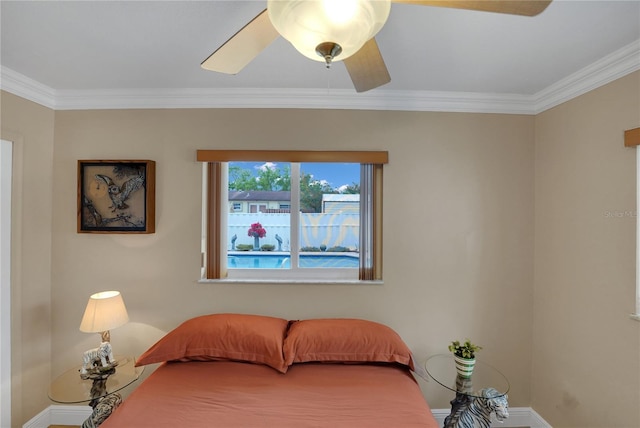 bedroom with baseboards, a ceiling fan, and crown molding